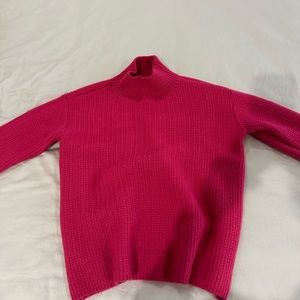 Pink, bulky knit sweater